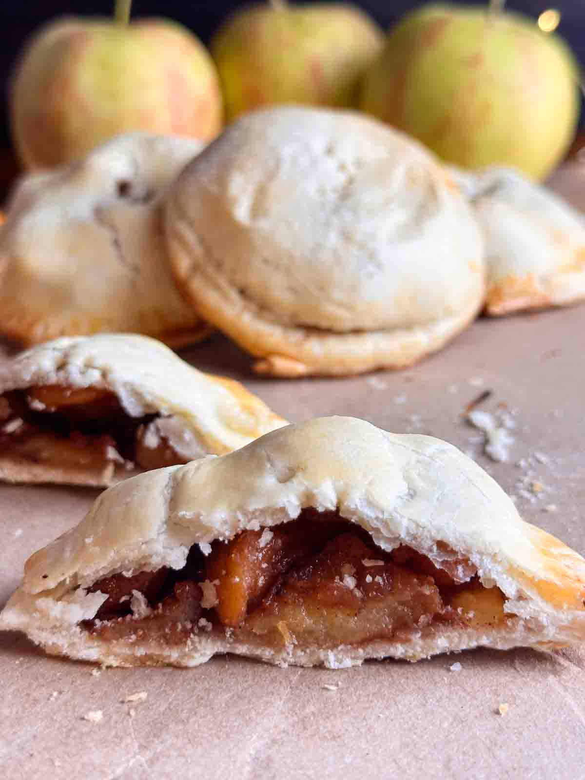 Mini apple pie cut in half.