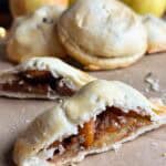Mini apple pie sliced in half.