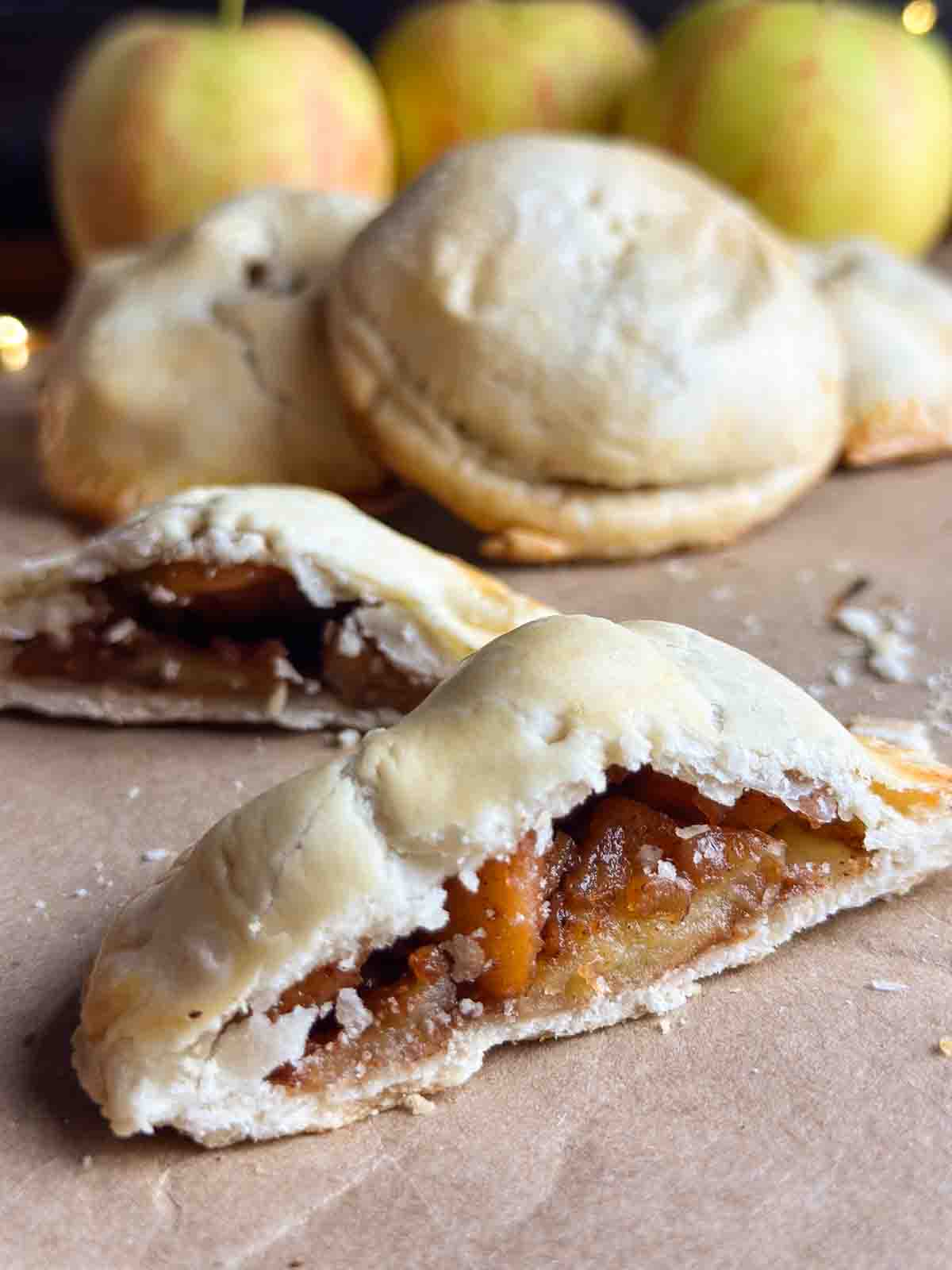 Mini apple pie sliced in half.