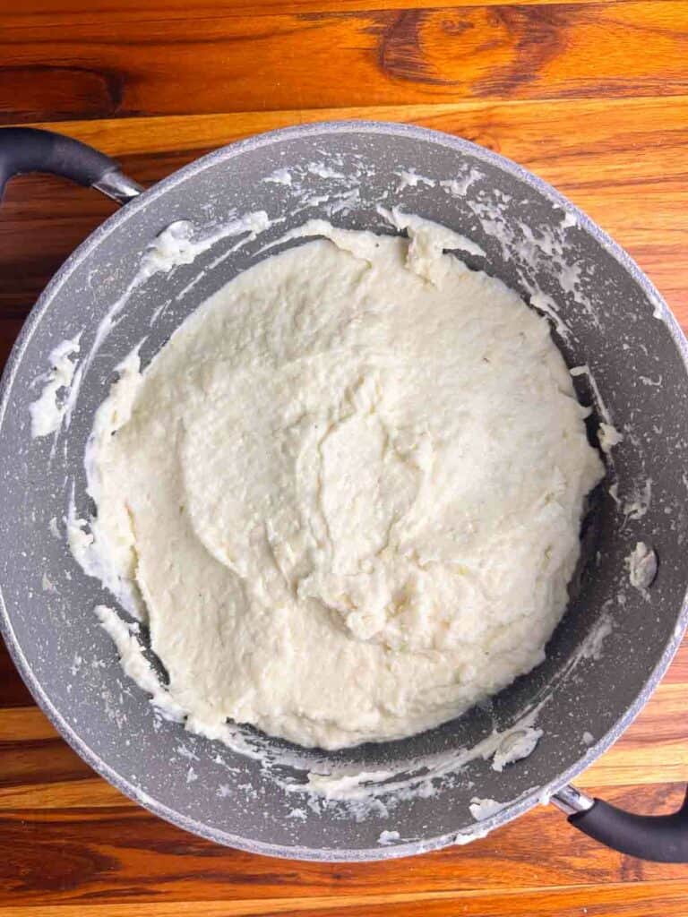 Mashed potatoes in a pot after mashing them.
