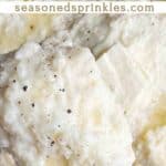 Cheesy mashed potatoes with butter on top. Text reads: cheesy mashed potatoes, seasonedsprinkles.com.