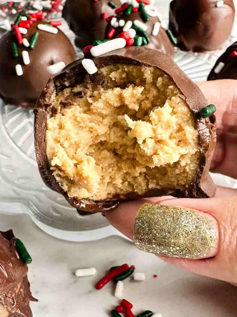 Chocolate peanut butter ball biten in half.