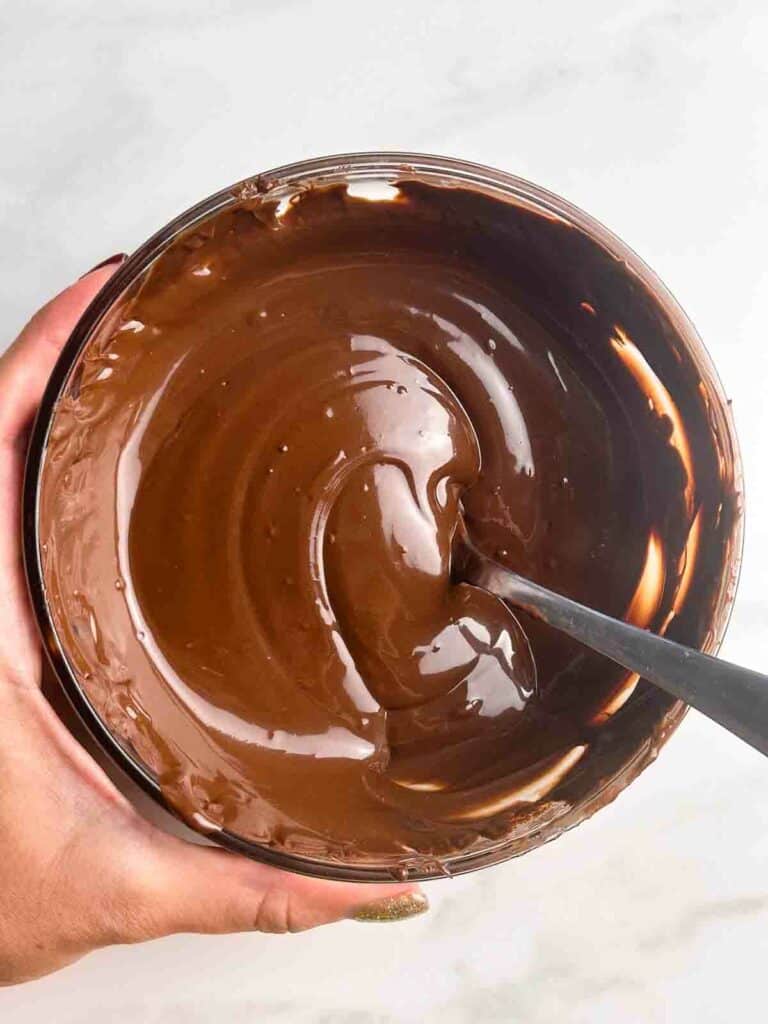 Melted chocolate ready to dip peanut butter balls in.