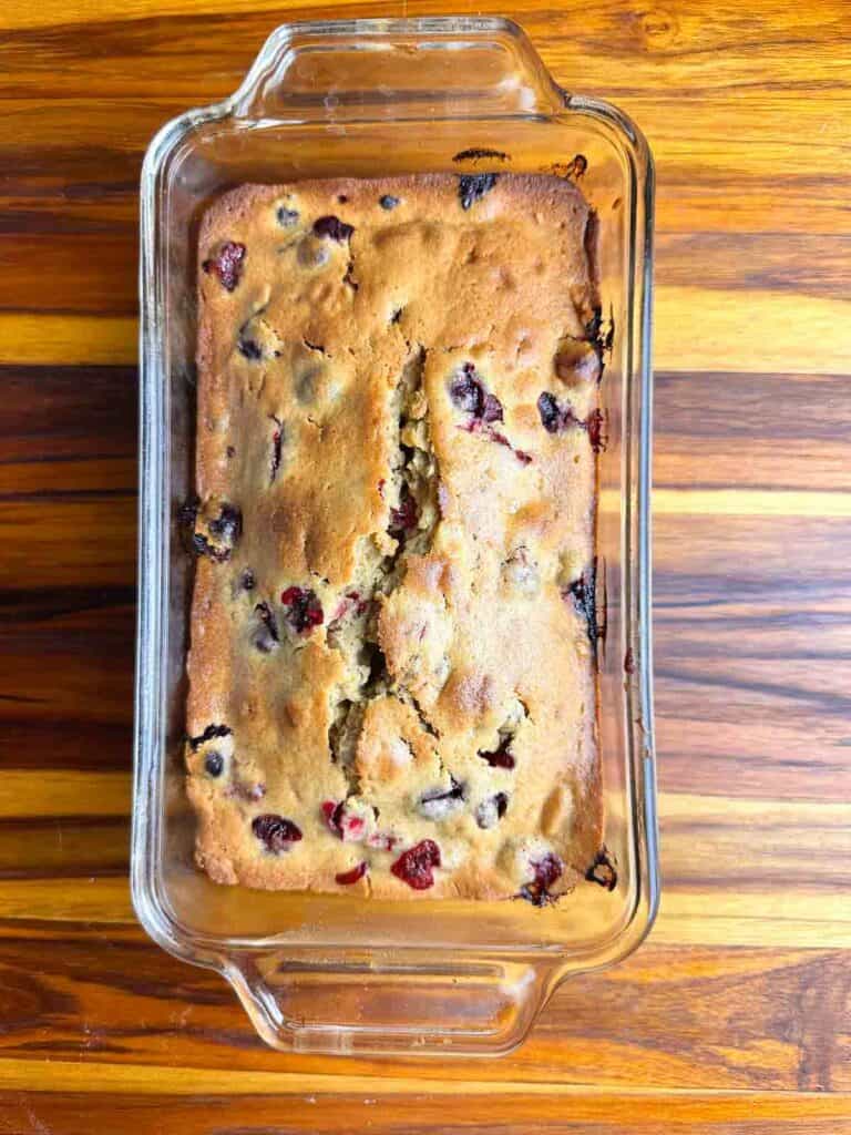 Freshly baked cranberry orange bread with walnuts.