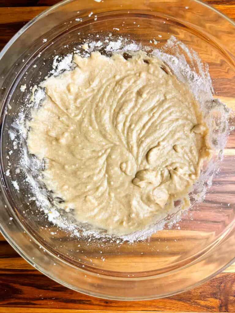 Batter for cranberry orange nut bread after adding in first half of wet ingredients.
