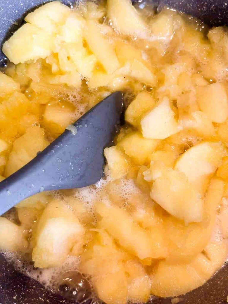 Stirring the cooked apples