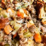 Sausage stuffing close up showing texture of breading, sausage, and veggies.