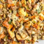 Sausage stuffing close up showing texture of breading, sausage, and veggies.