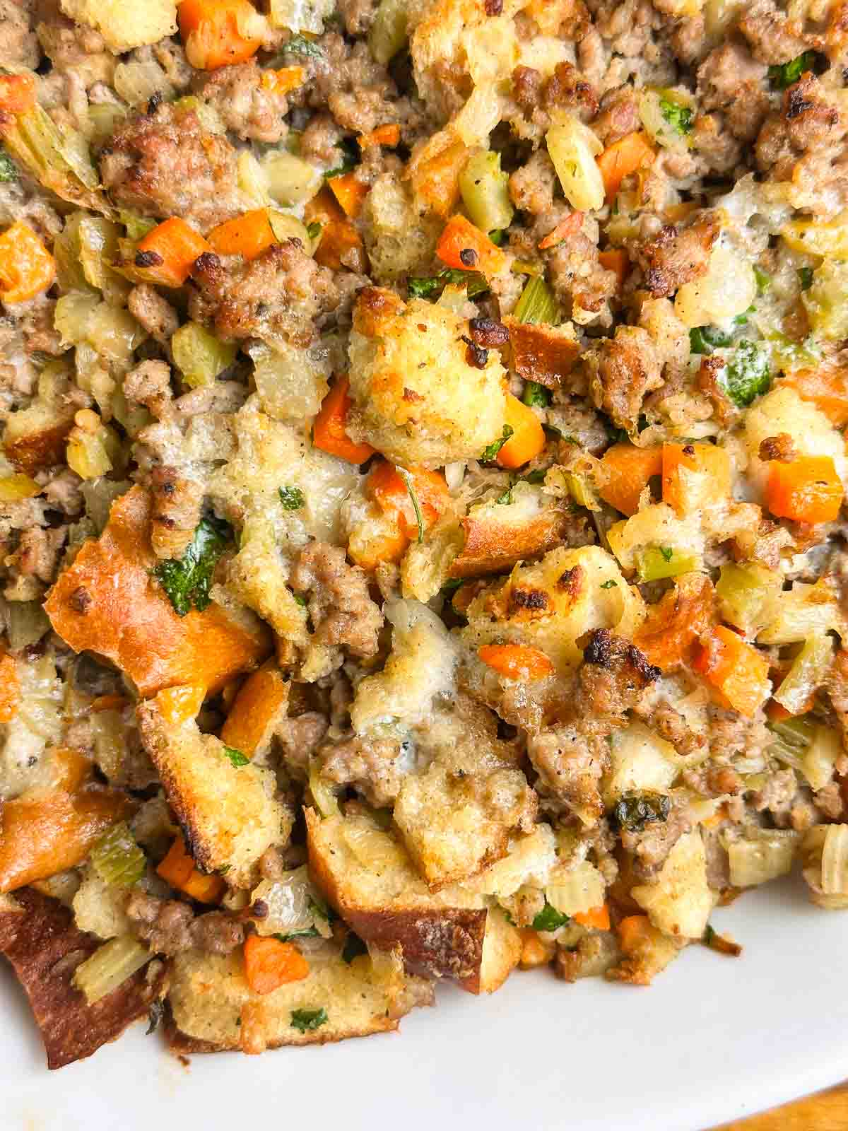 Sausage stuffing close up showing texture of breading, sausage, and veggies.