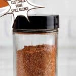 Bottle of fajita seasoning. Text reads: fajita seasoning, customize your spice blend, www.seasonedsprinkles.com