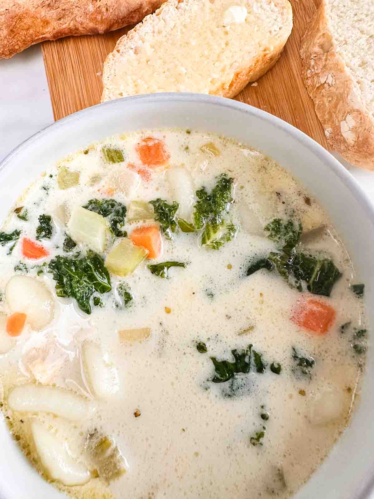 Serving Italian chicken gnocchi with freshly made bread.