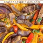Close up of sheet pan steak fajitas. Text reads: sheet pan steak fajitas, seasonedsprinkles.com