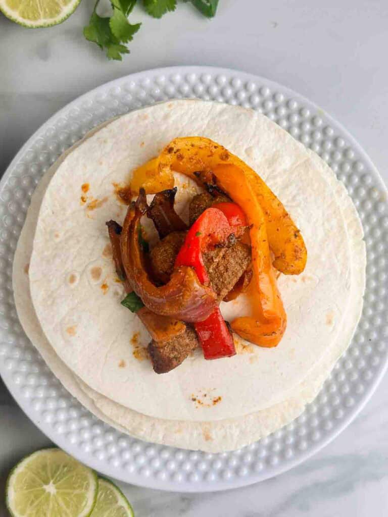 Steak pan steak fajitas plated.