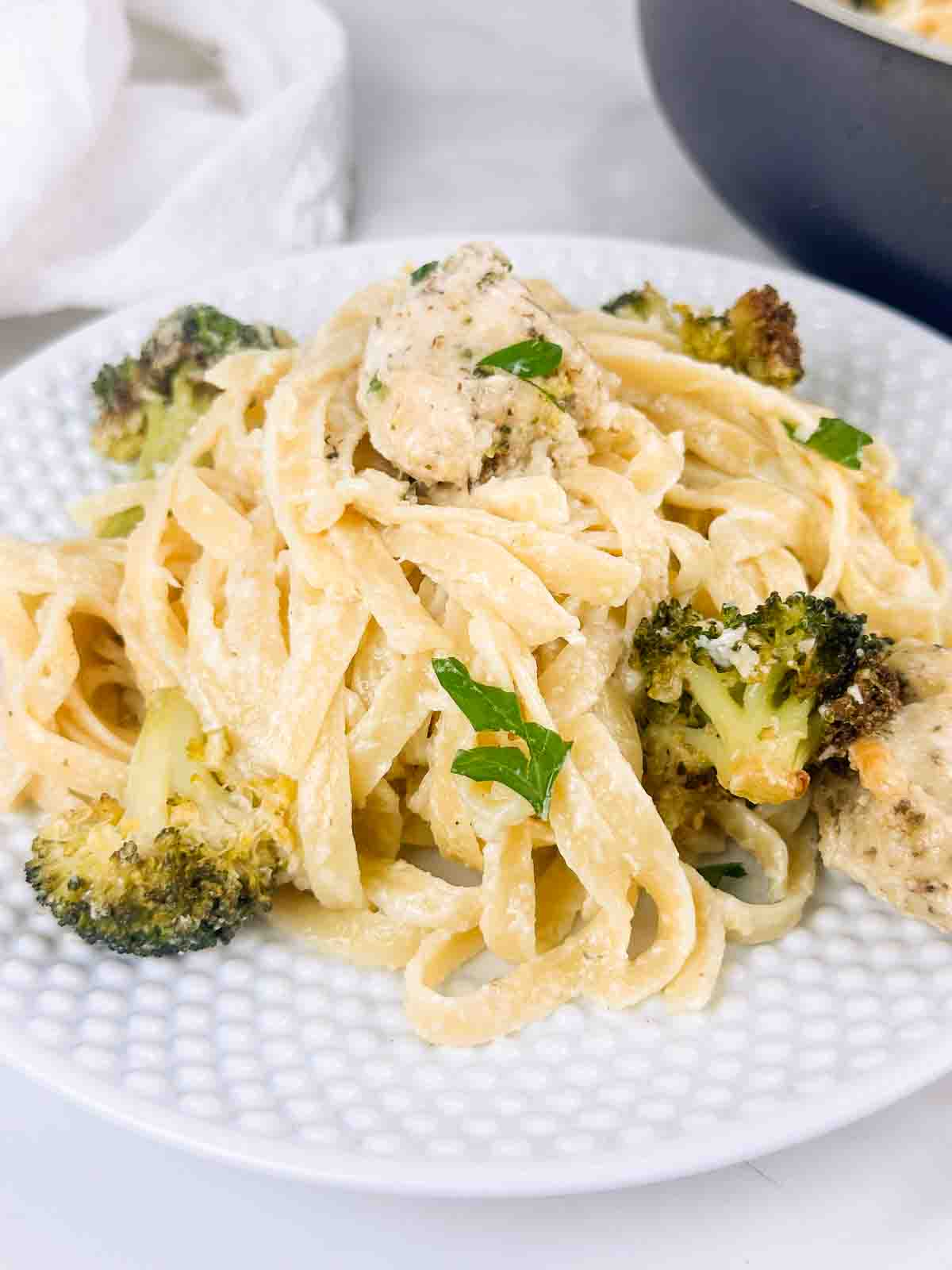 Finished shot of chicken and broccoli fettuccine alfredo.