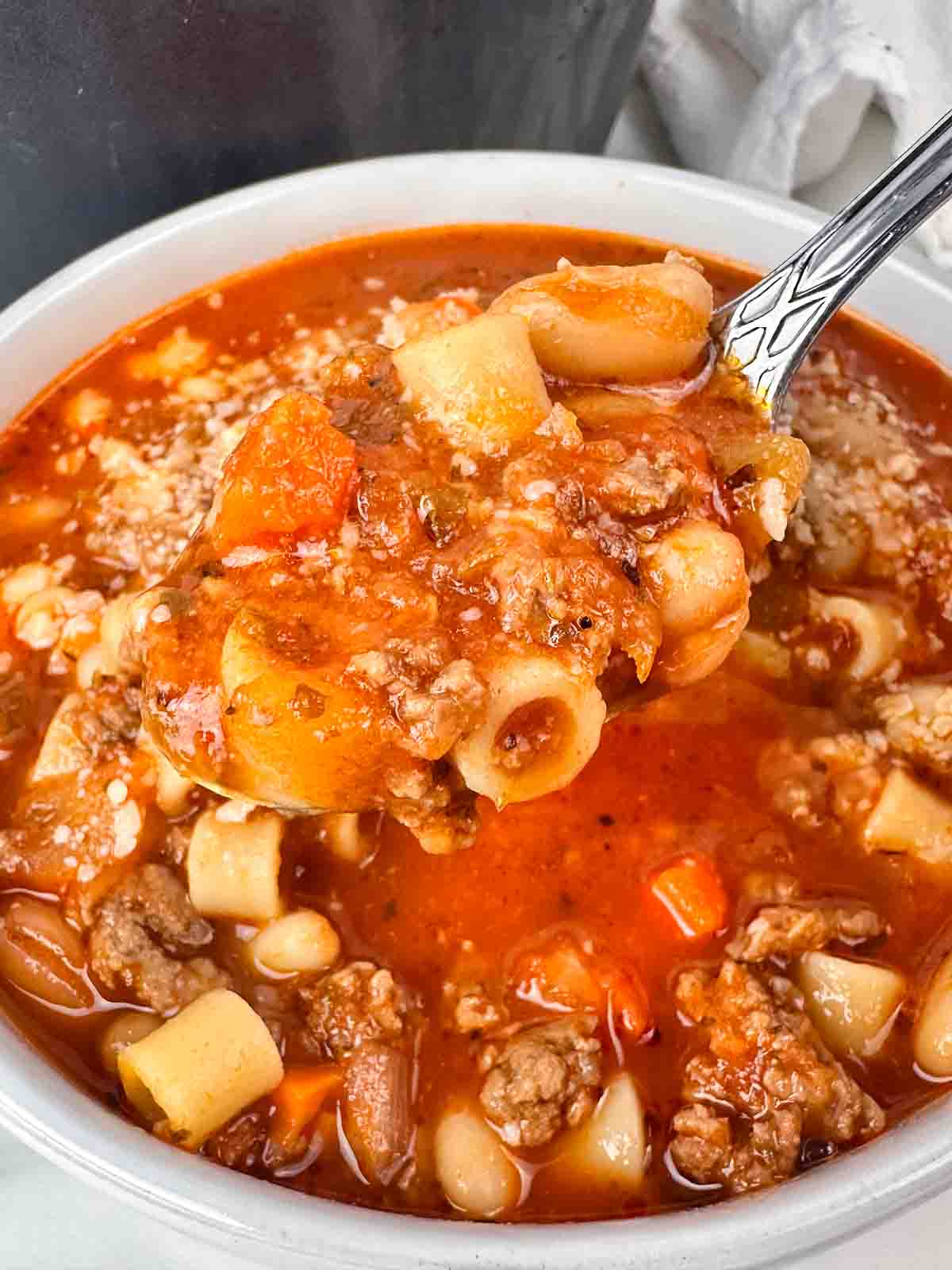 Pasta e fagioli in a white bowl.
