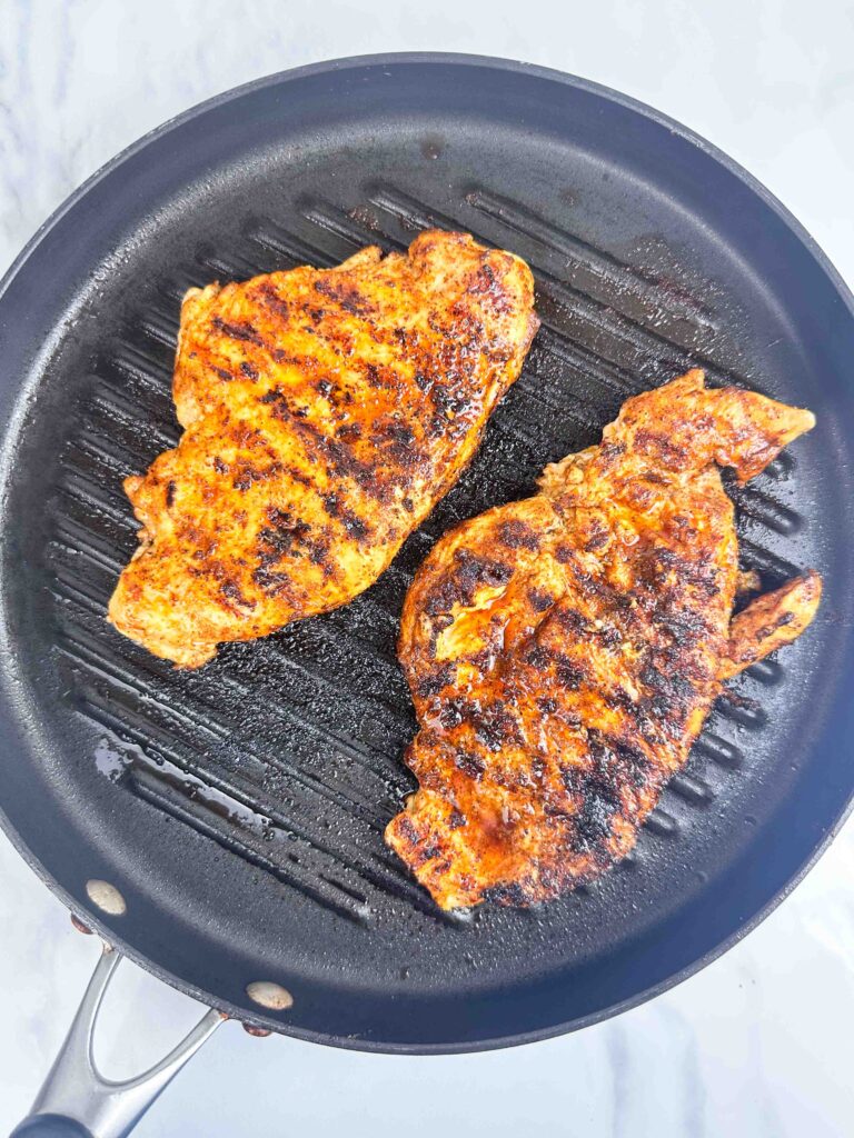 Grilled buffalo chicken chicken ready for buffalo wing sauce