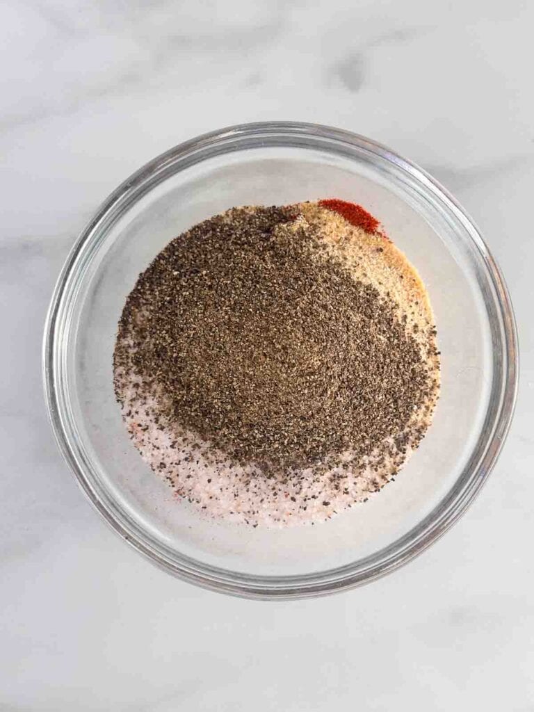 Ingredients for burger seasoning in a small bowl.