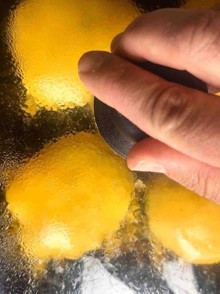 Melt cheese onto the burgers and cover them to let the cheese melt faster